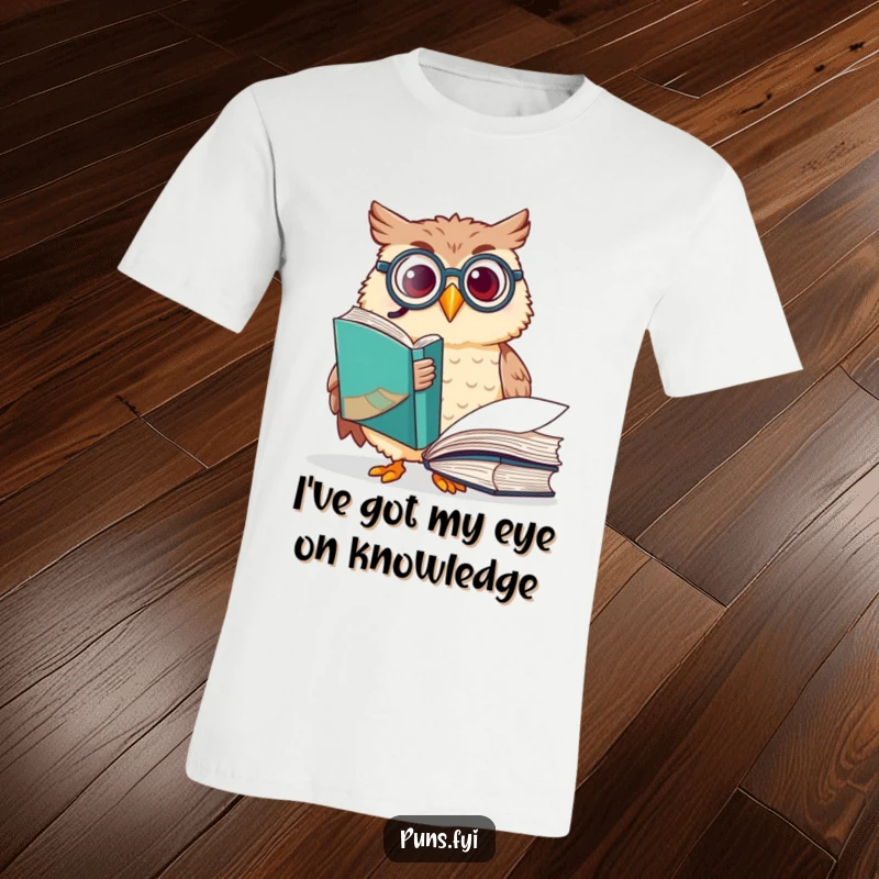 Funny owl t-shirt with a happy owl sporting a monocle, enthusiastically pointing at a large book, celebrating the joy of reading.