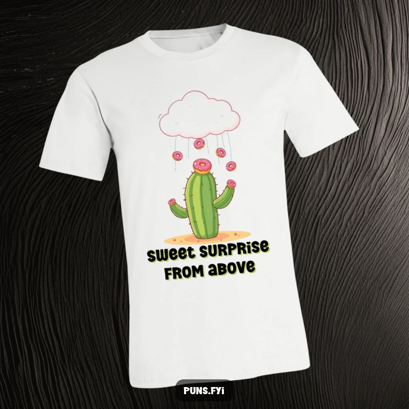 Funny t-shirt depicting a cloud showering tiny donuts onto a startled cactus, a whimsical and humorous scene.